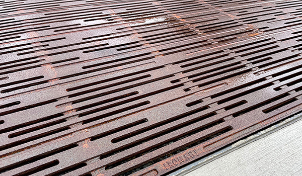 Cast iron grates in decorative Rain pattern by Iron Age Designs.