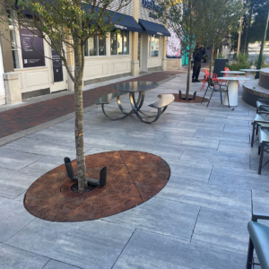 Custom cast iron elliptical tree grate in decorative Locust pattern by Iron Age Designs.