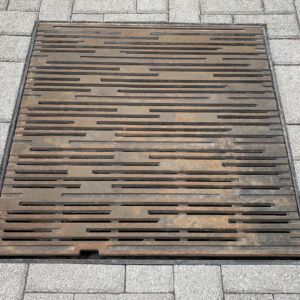 Cast iron grate in decorative Rain pattern by Iron Age Designs.